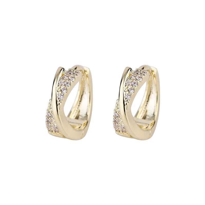 Geometric earrings with copper construction and 14K yellow finish featuring zircon sparkle treatment