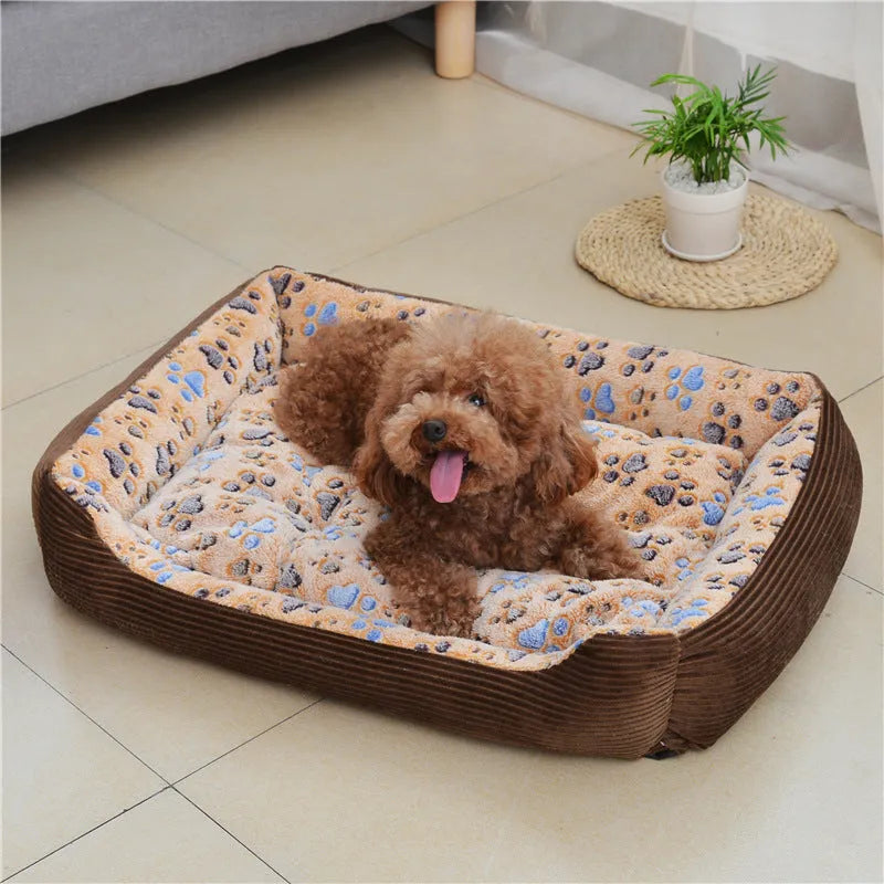 Camel coloured plush dog bed with sofa-style bolsters for small dogs, shown in Large 70x55cm size