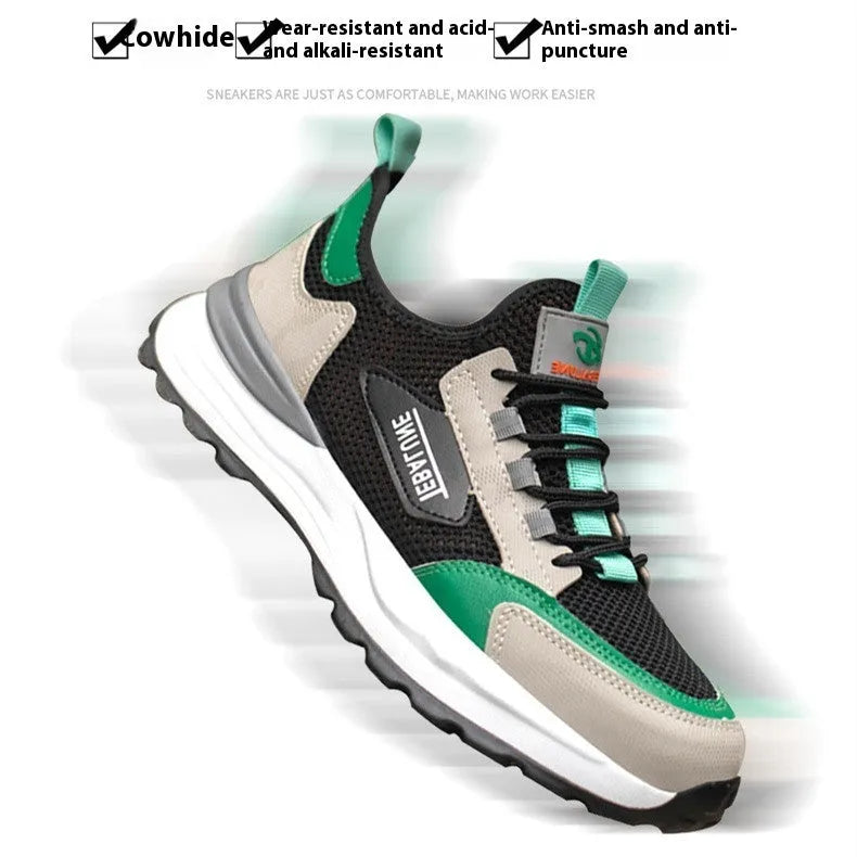 Black and green low-top safety shoe with mesh upper and plastic steel toe cap on a white background.