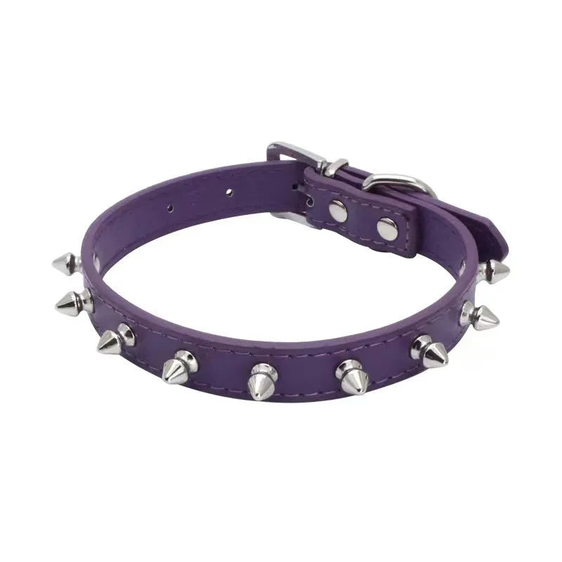 A spiked dog collar made of black PU leather with metal studs and an alloy metal buckle.