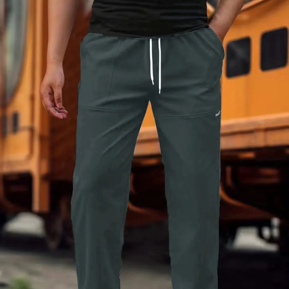 Men's casual polyester trousers for spring and autumn in light grey colour.