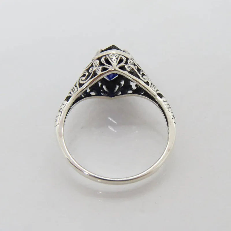Silver women's geometric hollow ring with zircon detailing on finger