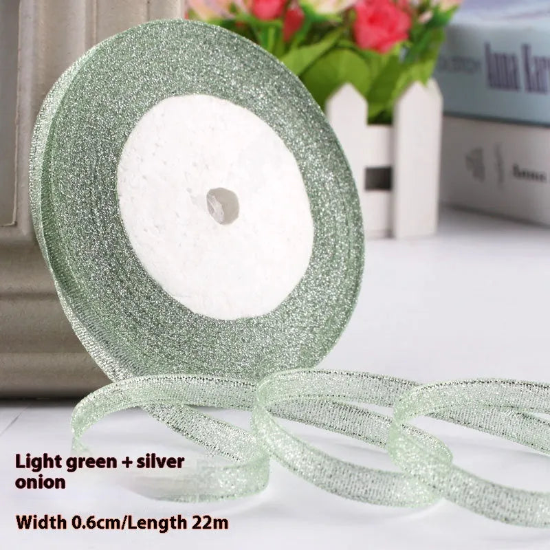 Roll of 0.6cm wide coloured polyester gift ribbon with 22 metre length.