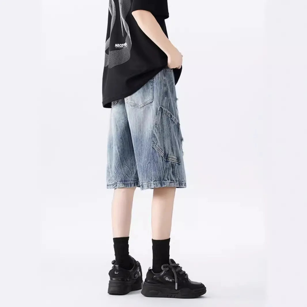 Men's vintage denim shorts with distressed detailing in loose fit design