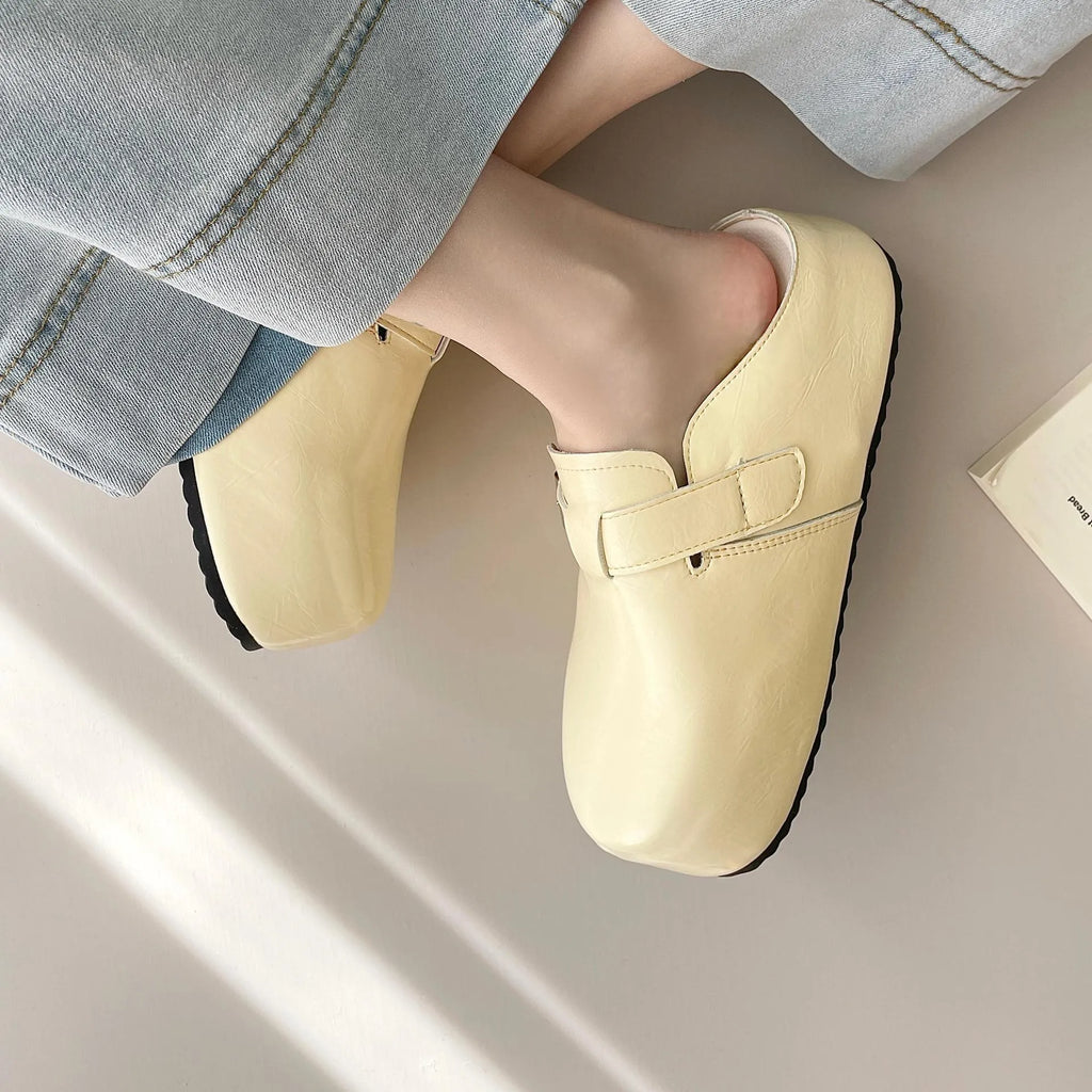 Flat buckle casual sneakers in yellow, round toe, PU upper, on a white background.
