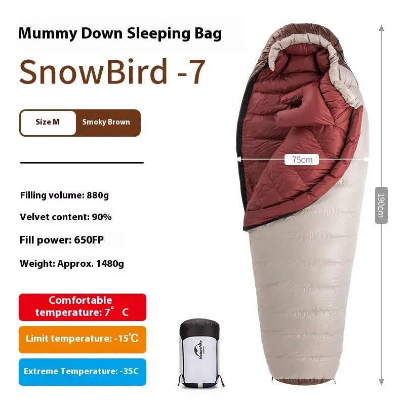 Goose down mummy style sleeping bag for adults with a storage bag.