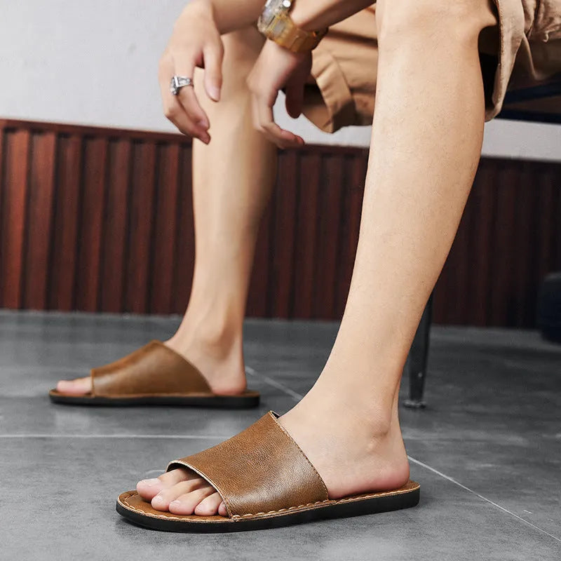 Men's brown leather outdoor sandals with rubber soles shown from side perspective