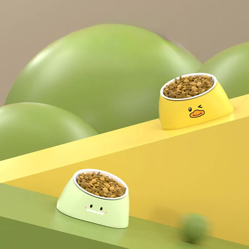 Green elevated pet feeding bowl with tilted stainless steel insert and wide anti-slip base.