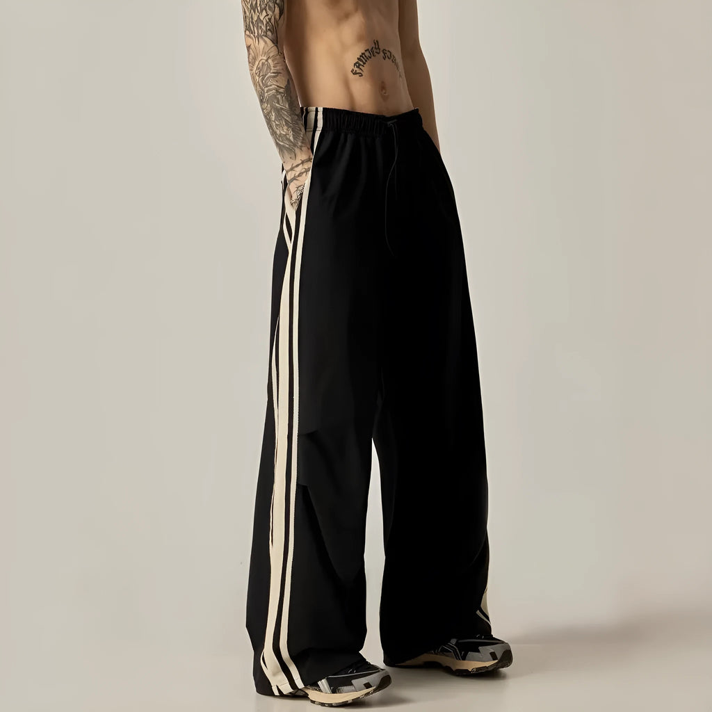 Men's black wide-leg climbing trousers with high waist and straight-leg design