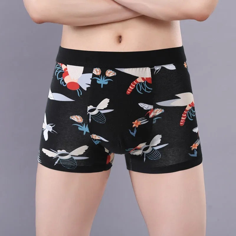 Men's cotton boxer shorts with floral print, showing mid-waist fit and U-shaped convex design.