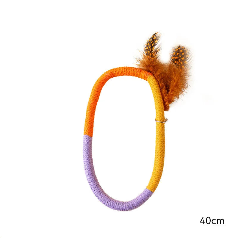 Green cotton rope cat toy with feathers and catnip for safe chewing and interactive play