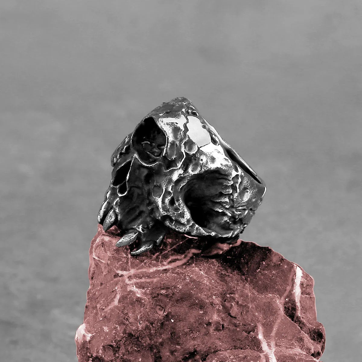 Electroplated alloy skull ring showing one-eyed design on finger, retro punk hip hop style