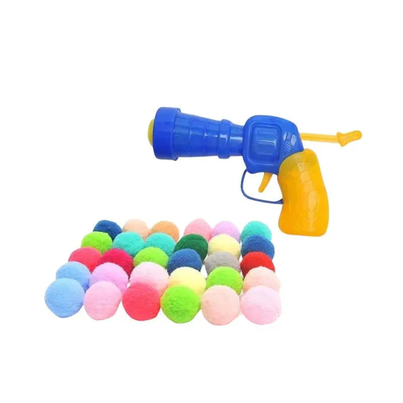 Plush cat toy launch gun with soft yarn balls for interactive indoor pet play.