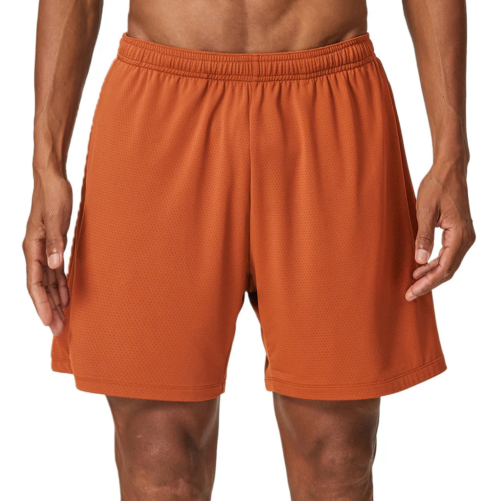 Men's double-layer quick-drying running shorts in brick red colour on a mid-waist model.
