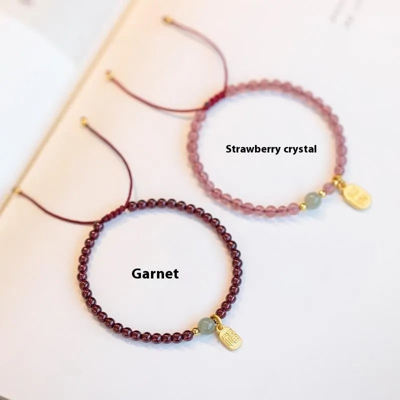 Hand-woven red rope bracelet with crystal beads in strawberry quartz or garnet variants