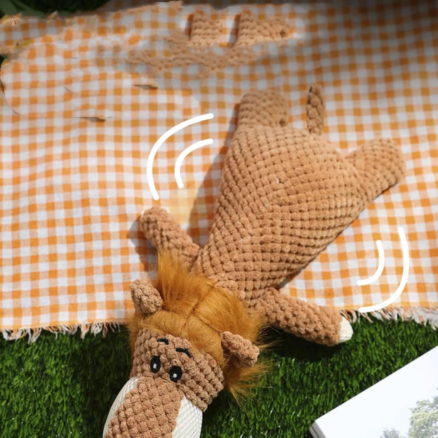 Interactive plush dog chew toy with corn kernel texture and squeaker in grey colour.