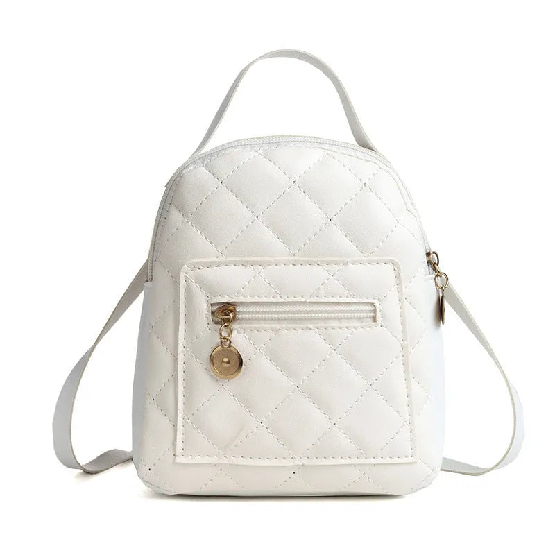 Girls' hard case Korean-style embroidered backpack in pink showing vertical square shape and soft carry handle.