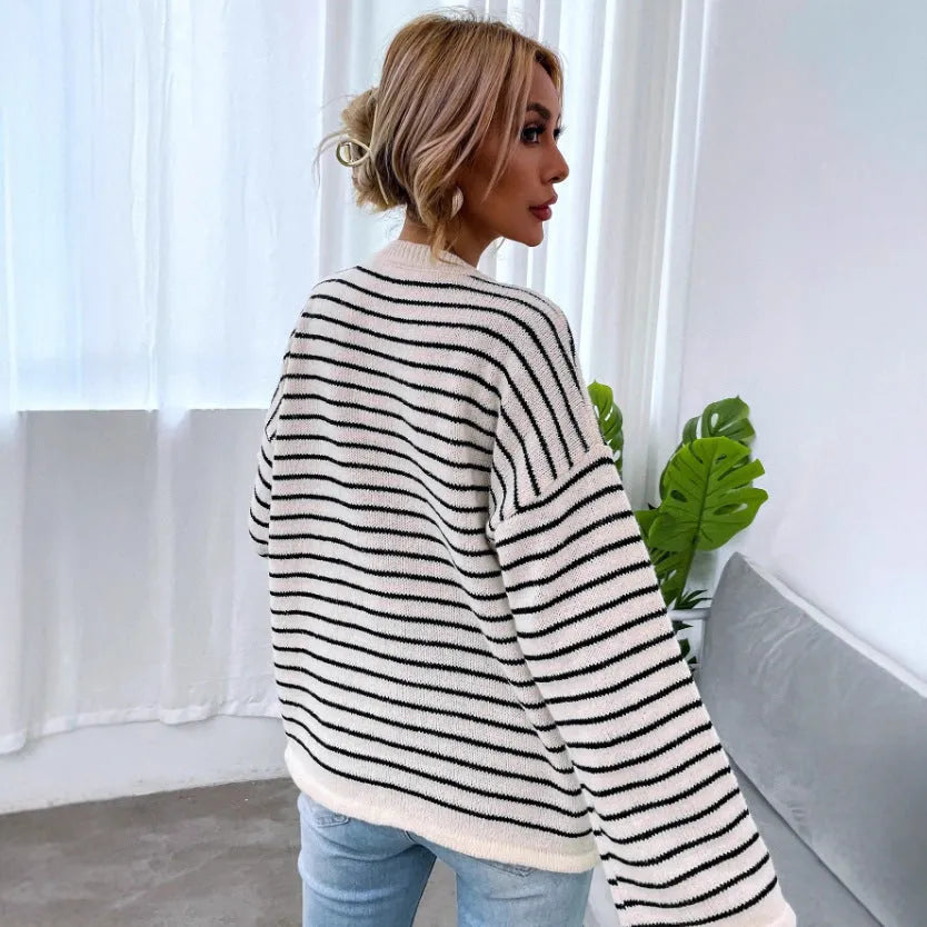 Black striped women's casual long sleeve top with drop shoulders and button details