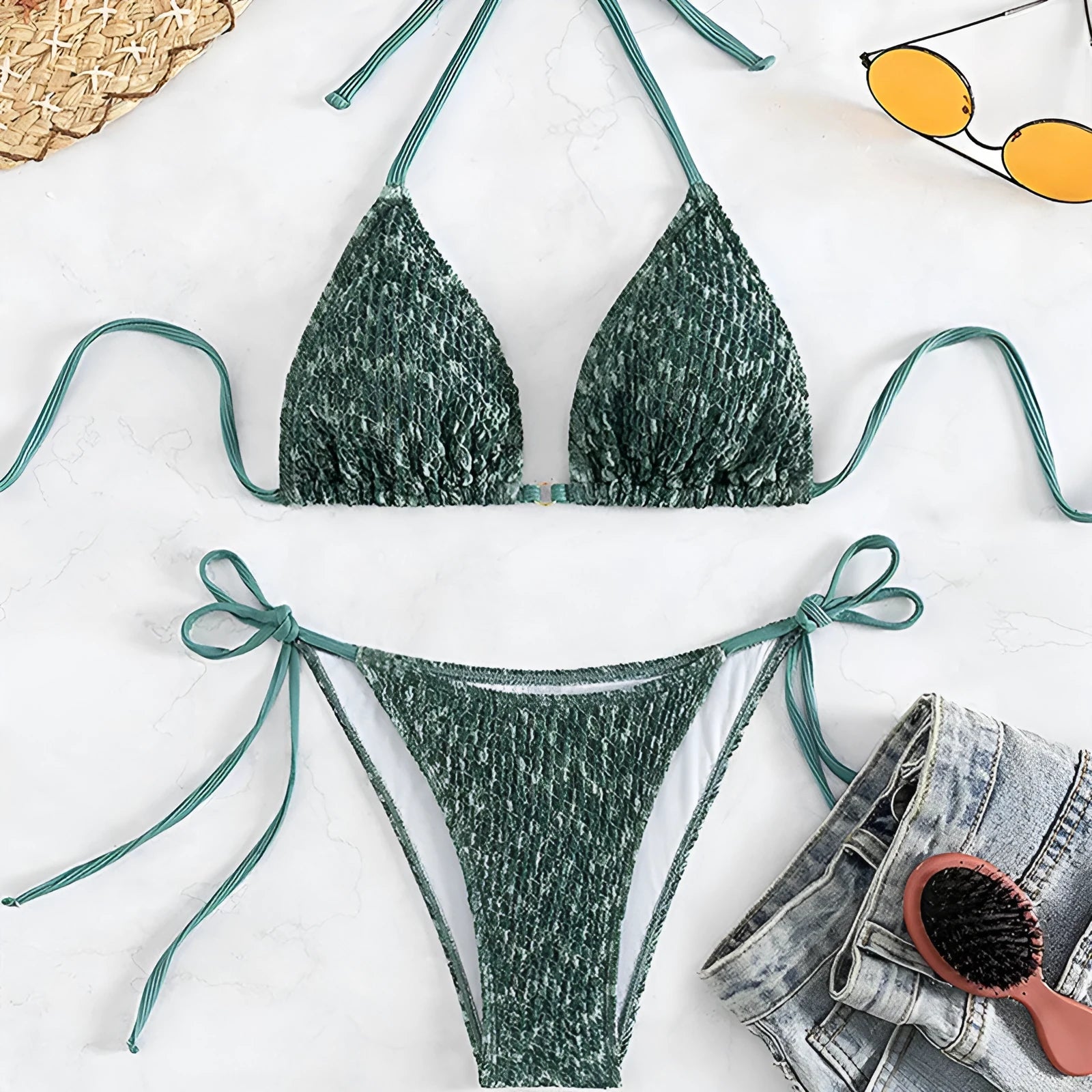Women's green halter strap backless swimsuit set with three-point design and matching shorts