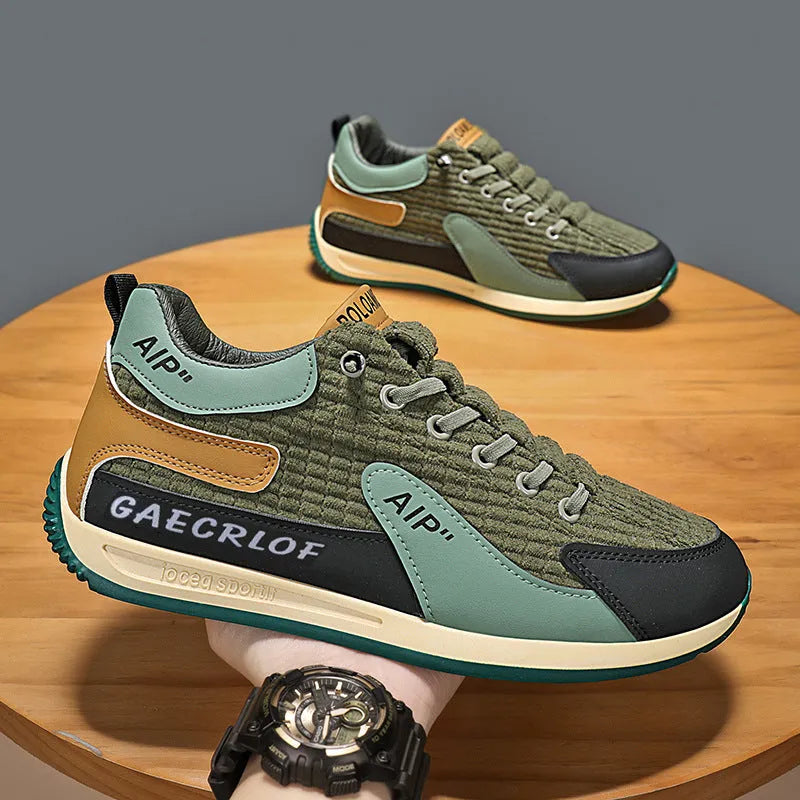 Men's green and grey low-top mesh running shoes with round toe and lace-up front.