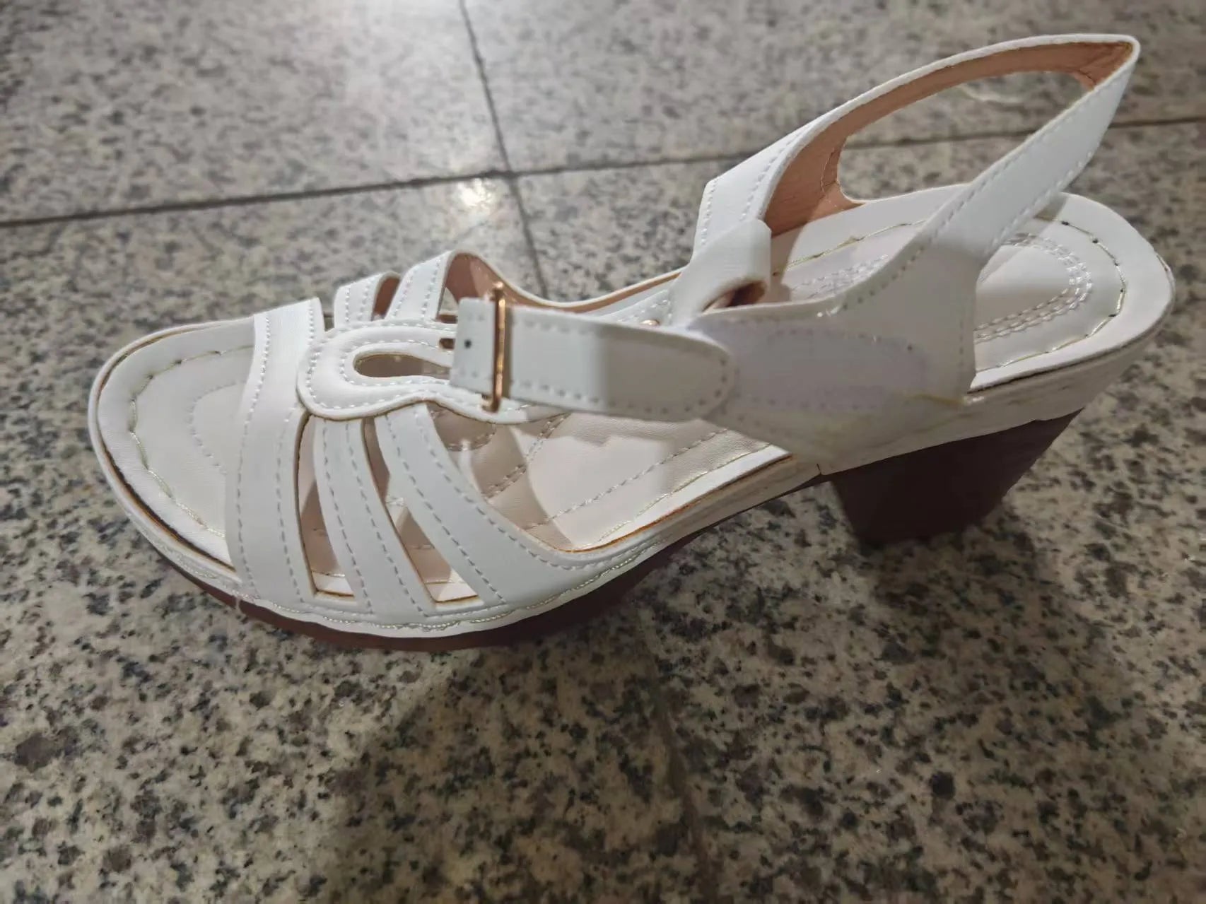 Women's peep toe wedge platform sandals in a light colour with a buckle strap