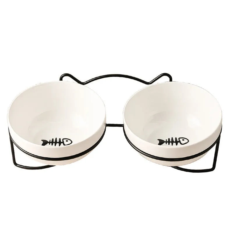 White ceramic pet bowl with decorative pattern in iron frame with cat ear accents