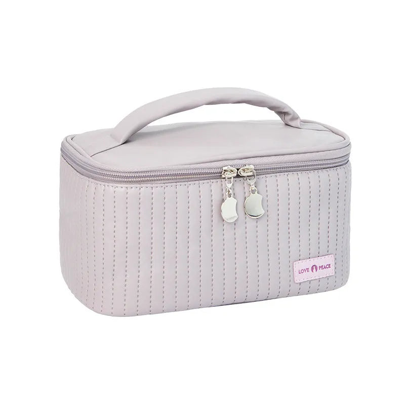 Open-top PU leather makeup bag in a choice of six solid colours including pink, coffee, and light blue.