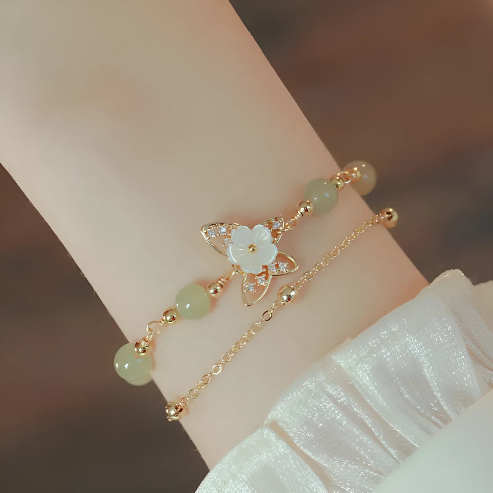 Yellow gold shell flower butterfly bracelet for women with geometric shape and bells of Ireland design