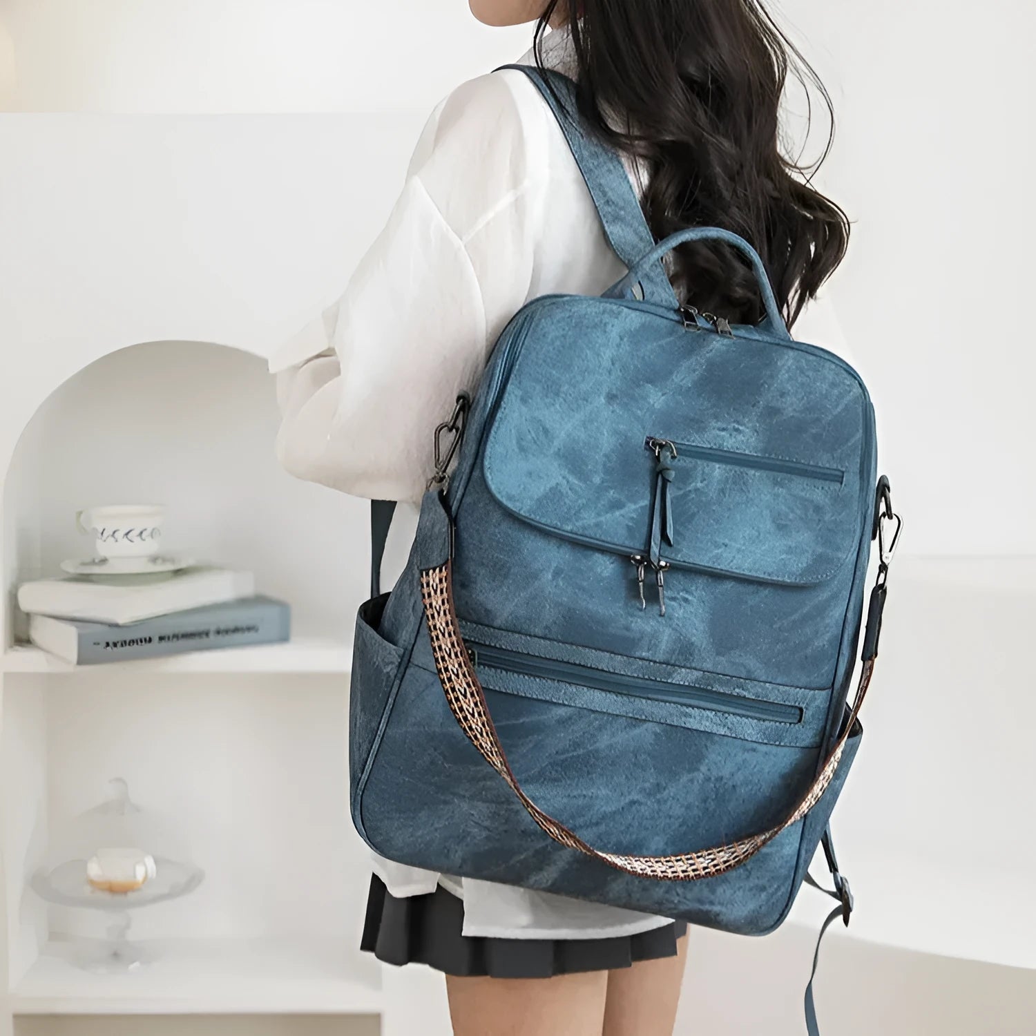 Solid colour retro college backpack with curved shoulder straps, shown in multiple colour options including black and blue.