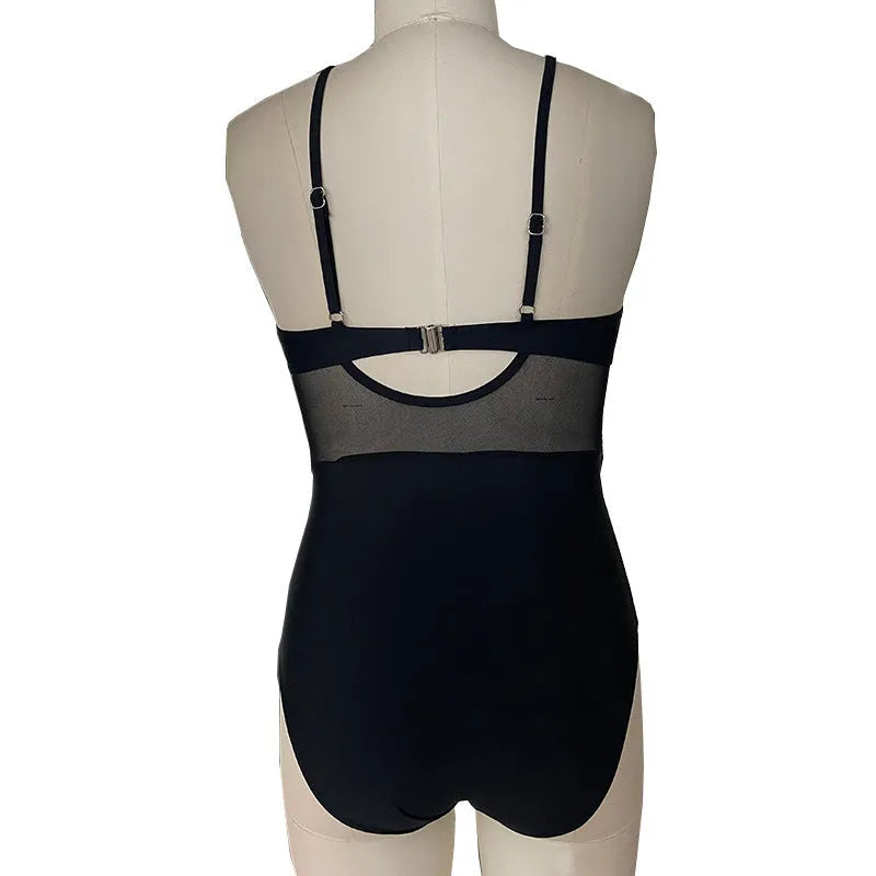 Women's mesh spliced backless one-piece swimsuit in solid colour black with polyester lining for swimming and wading sports