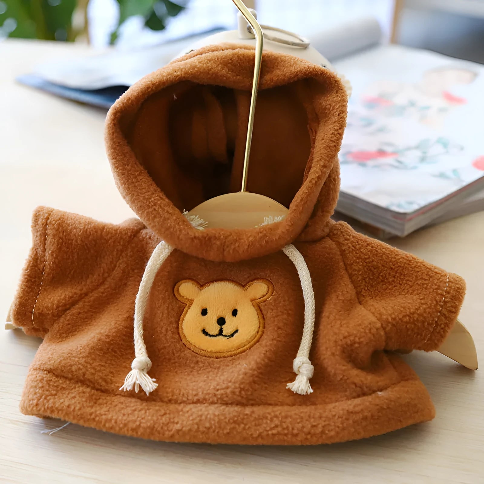 A blue cloth pet hoodie sweater for dogs or cats, shown on a mannequin.