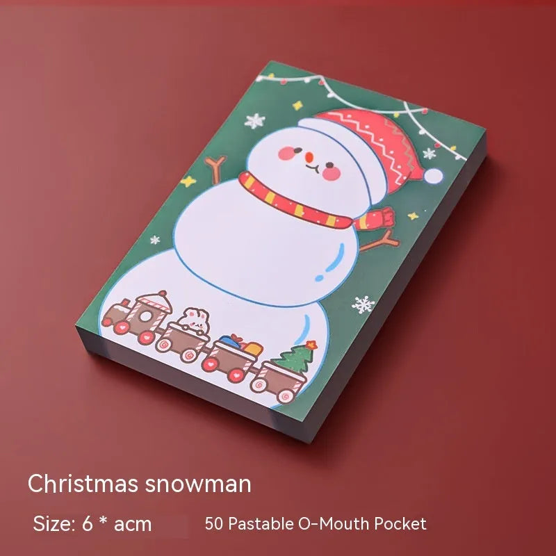 Christmas sticky notes pad showing eight festive designs including Santa Claus, elf, snowman, and gift box
