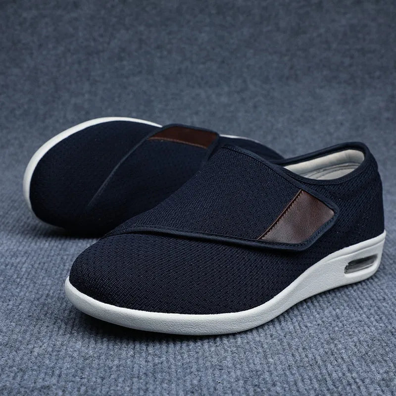 Beige widened fit leisure shoes with Velcro strap and rubber foam sole.