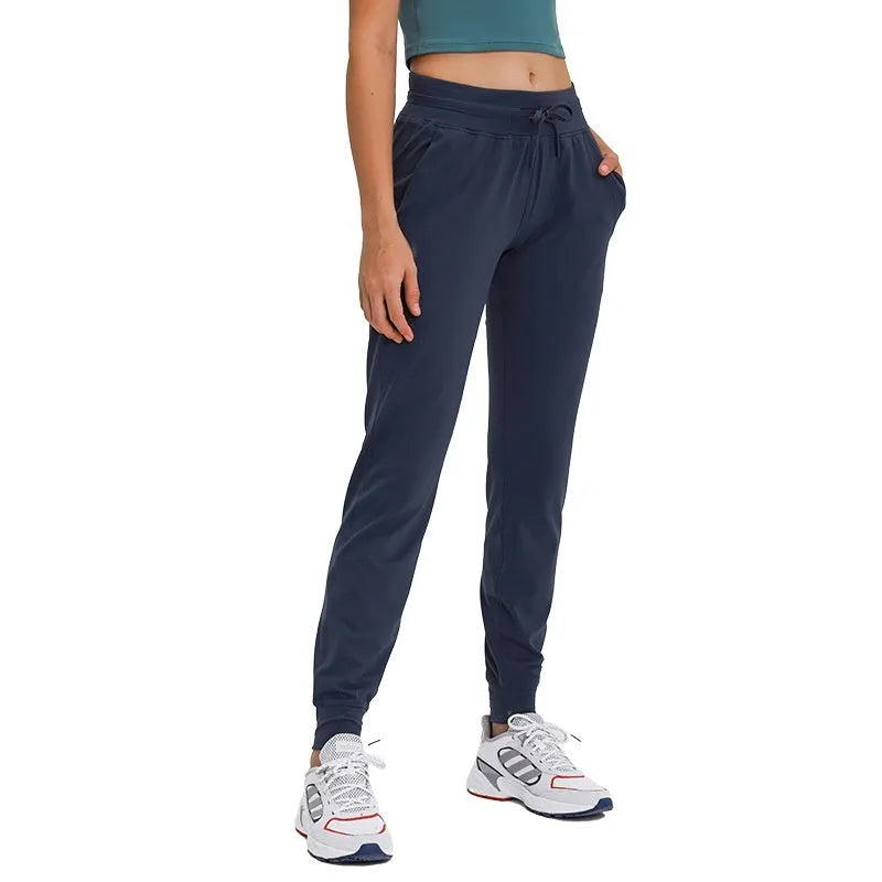 Women's high waist yoga pants with drawstring waistband in quick-drying cotton blend fabric, multiple colour options