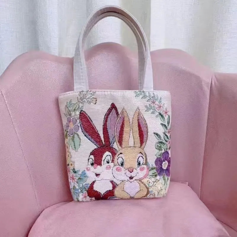 Double-sided gold wire embroidery canvas handheld bag showing decorative detailing