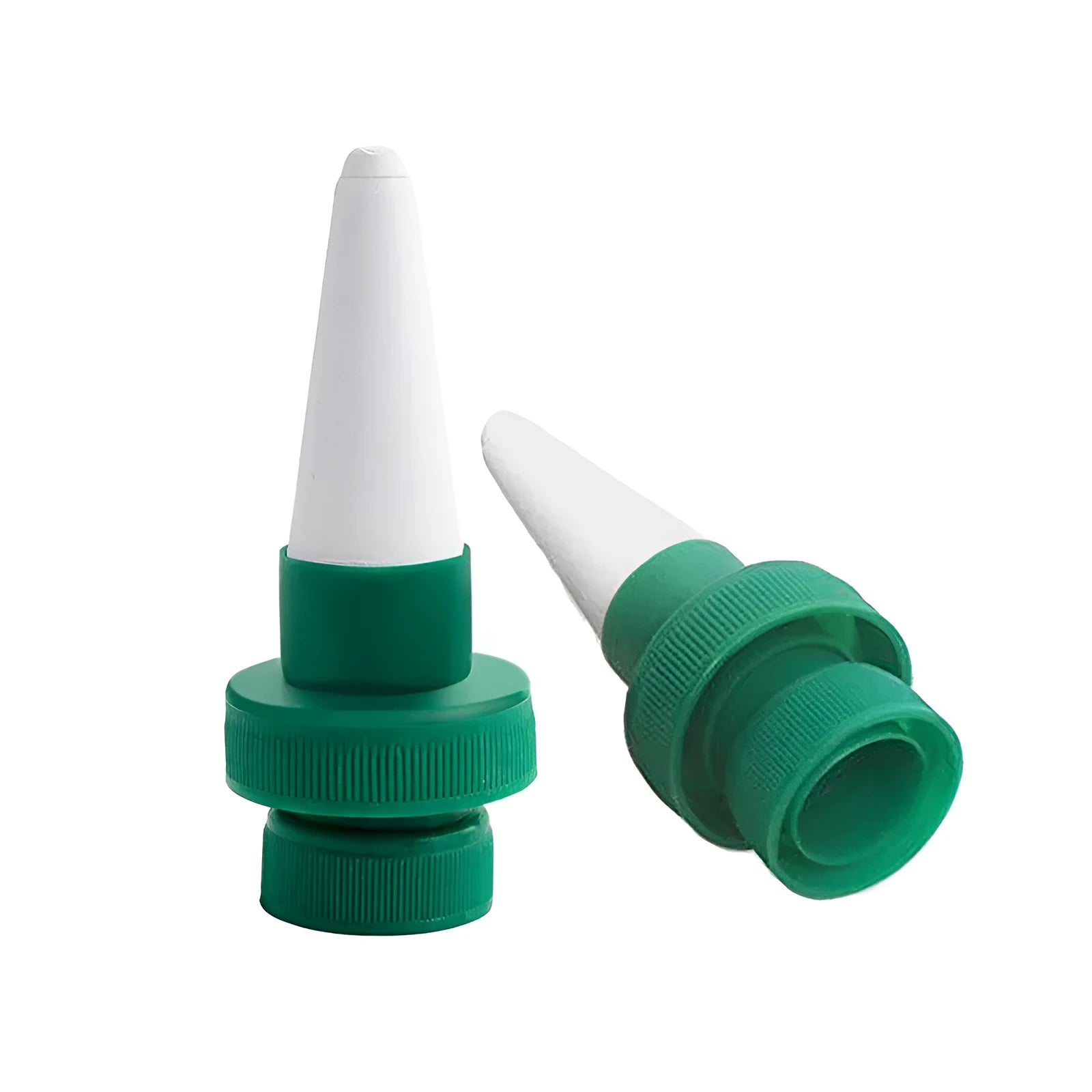 Green ceramic automatic plant dripper attached to cola bottle for watering indoor plants