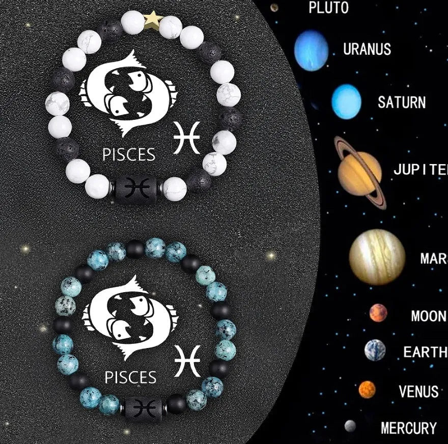 Two natural stone beaded zodiac bracelets with adjustable strings on wooden surface