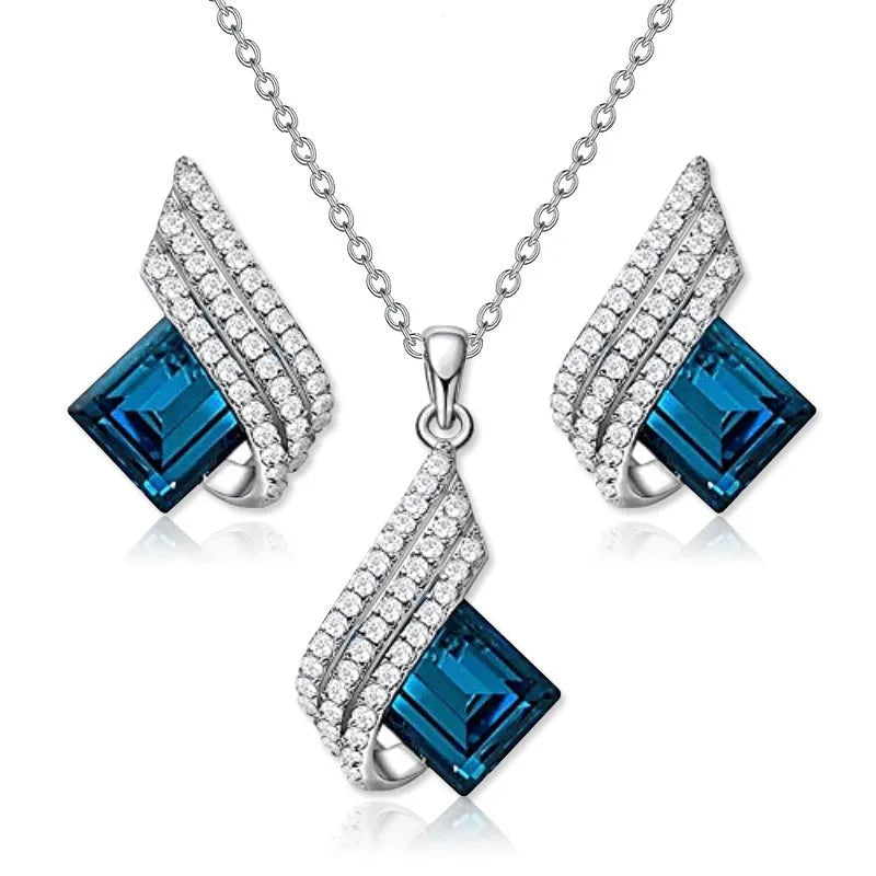 Electroplated alloy necklace and earring set with glass pendant and cross chain design