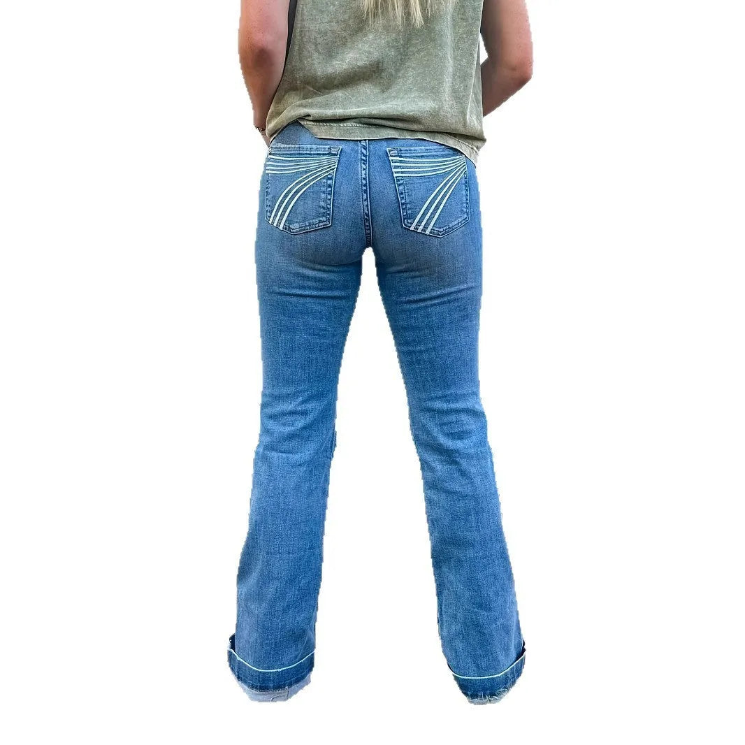 Slim fit mid-waist jeans with slight flare and embroidery detailing on blue denim