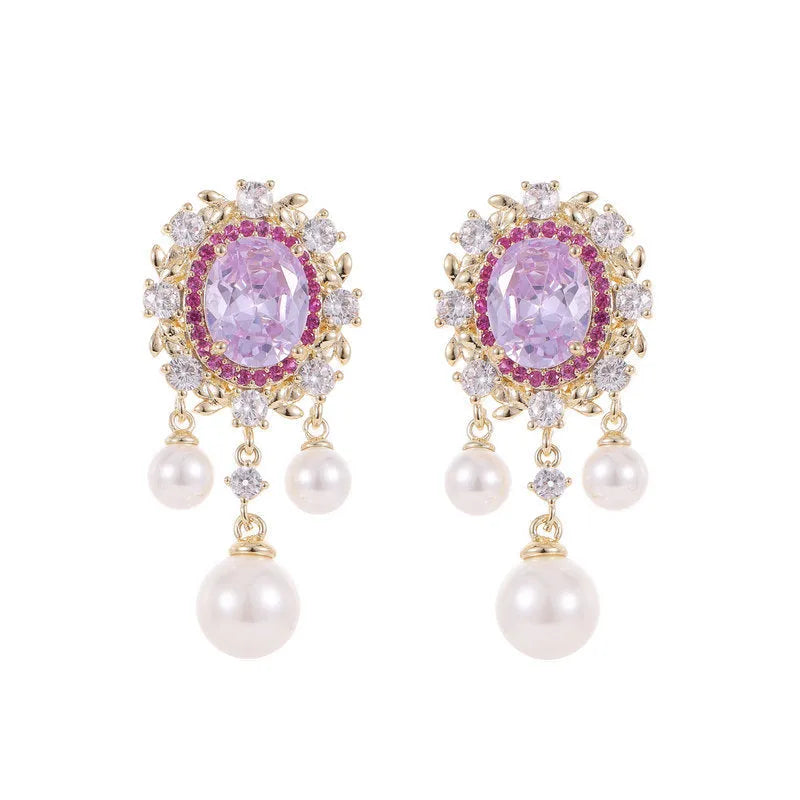 Oval-shaped geometric drop earring with a pearl tassel and inlaid zircon crystals in light purple.