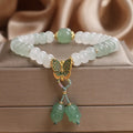 Green crystal women's bracelet with Tian Shan Cui abacus beads and retro butterfly tassel design