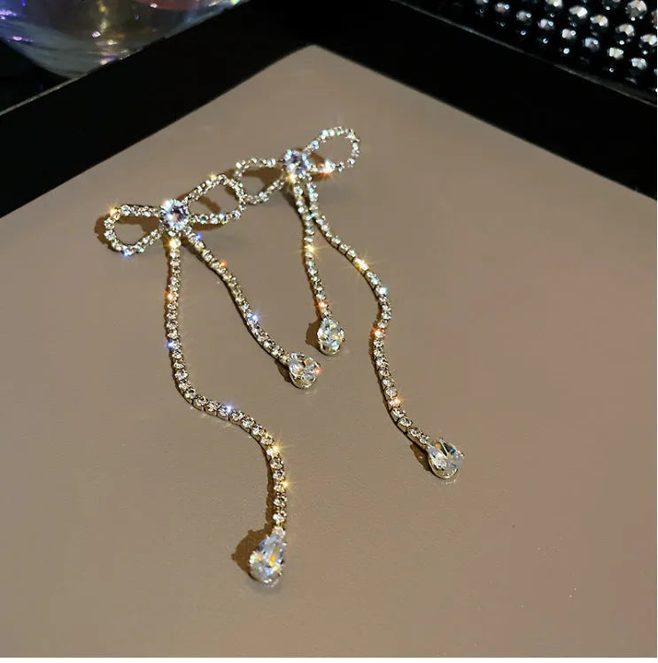 Fashion jewellery silver needle long bow tie full-jeweled stud earrings for women in gold and silver drop shape