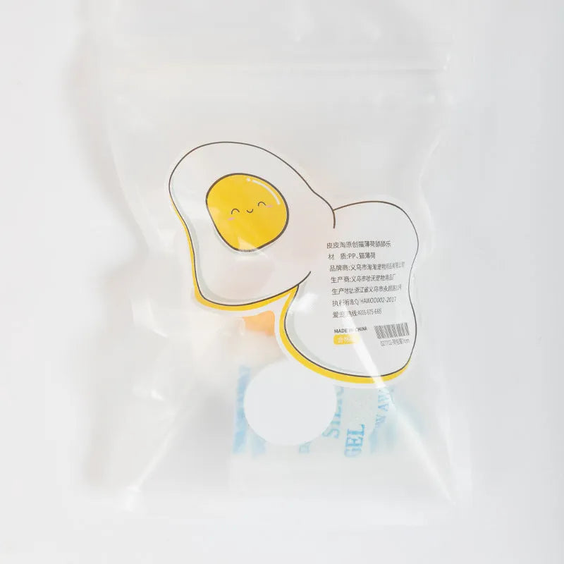 Interactive catnip ball toy with soft plush construction in fried egg and poached egg sizes
