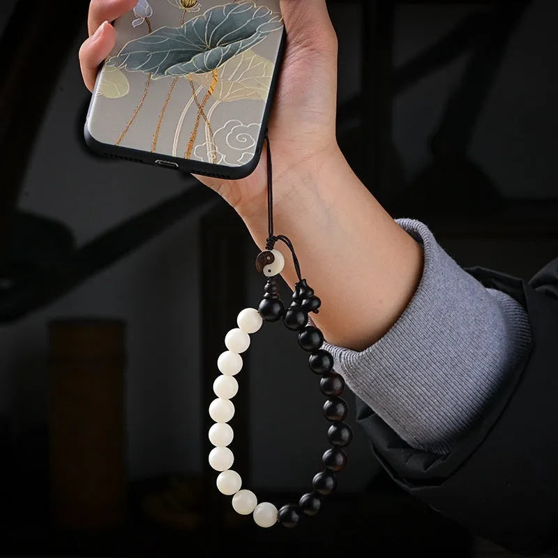 Handcrafted Bodhi seed bracelet with white Corypha Umbraculifera and Blackwood beads in eight-diagram pattern