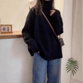 Women's thick loose-fit turtleneck sweater with curling pile collar in red, camel, grey, or black.