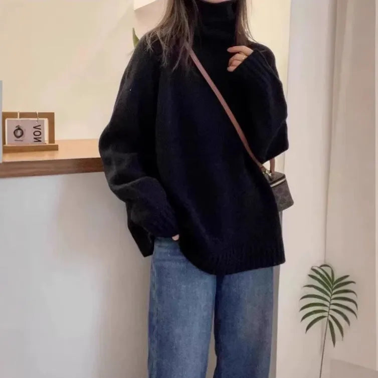 Women's thick loose-fit turtleneck sweater with curling pile collar in red, camel, grey, or black.