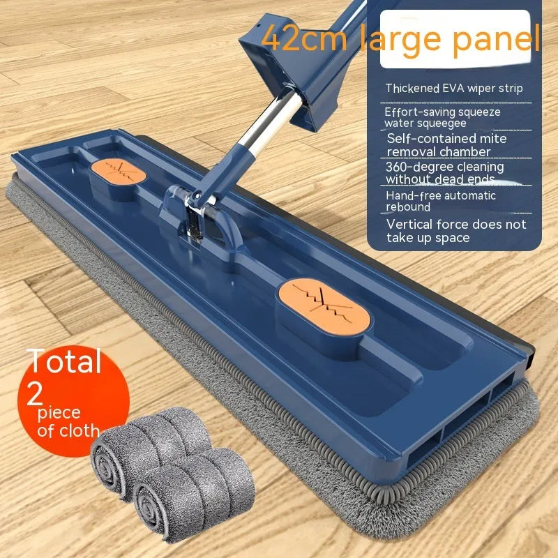 Large flat mop with blue cloth on a wooden floor, showing its 360-degree rotating head and long stainless steel handle.