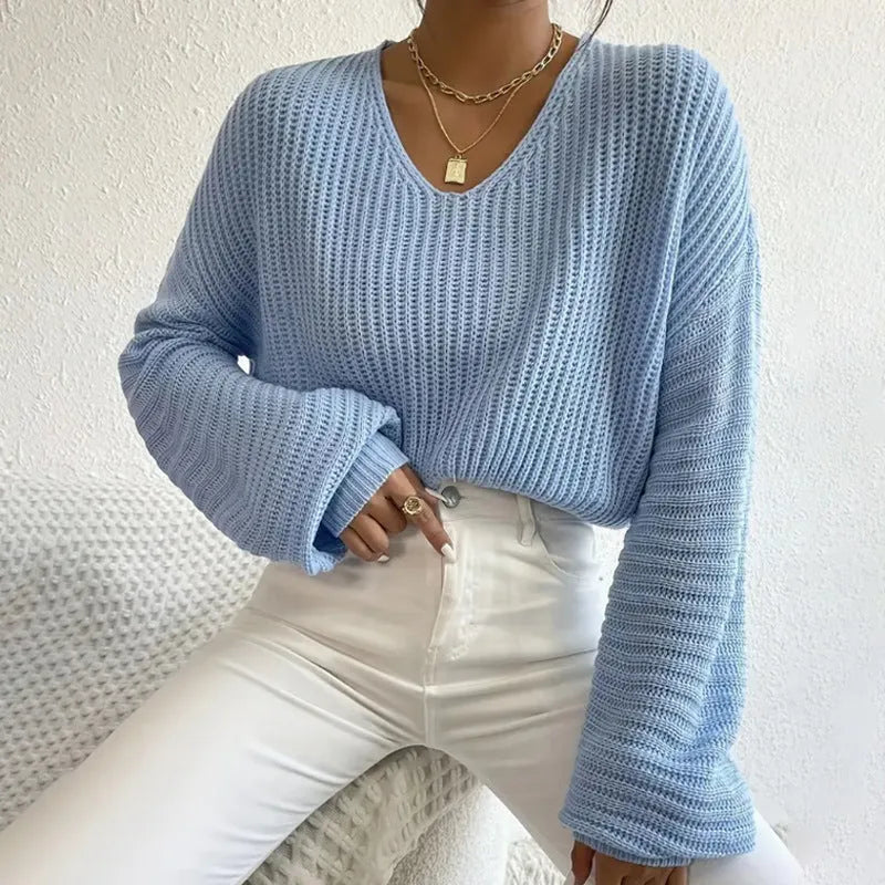 Women's solid colour long sleeve loose pullover in black, pink, green, blue, or red.