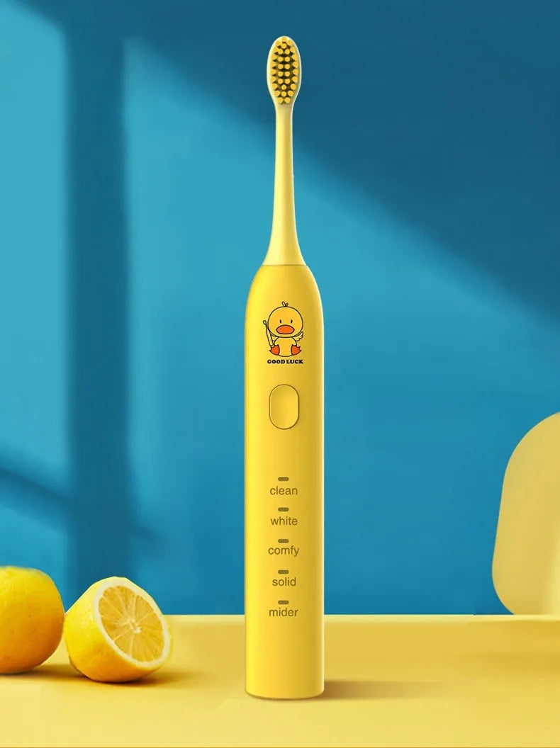 Yellow rechargeable smart electric toothbrush with soft bristle head and USB charging cable