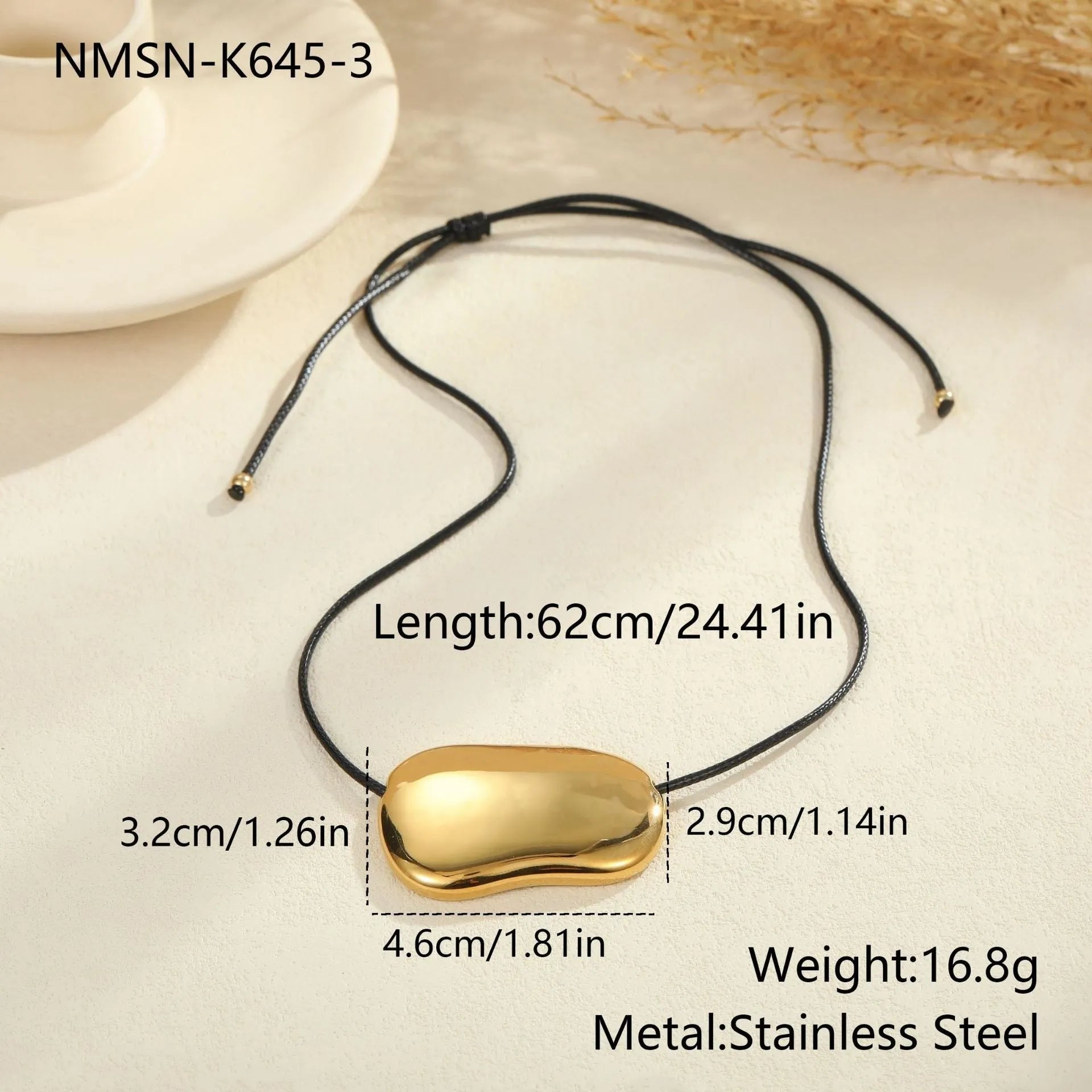 Close-up of a minimalist geometric pendant on an adjustable stainless steel necklace chain.